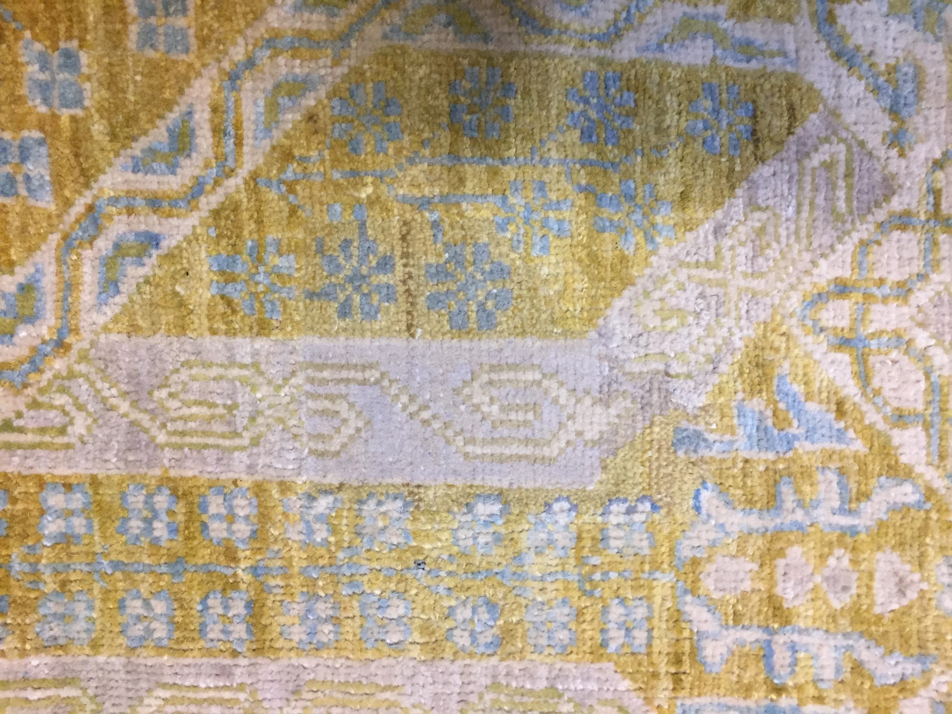 Oushak rug with invisibly rewoven pile matching the original pattern after repair — Ahmadi Rug, Gold Coast Chicago