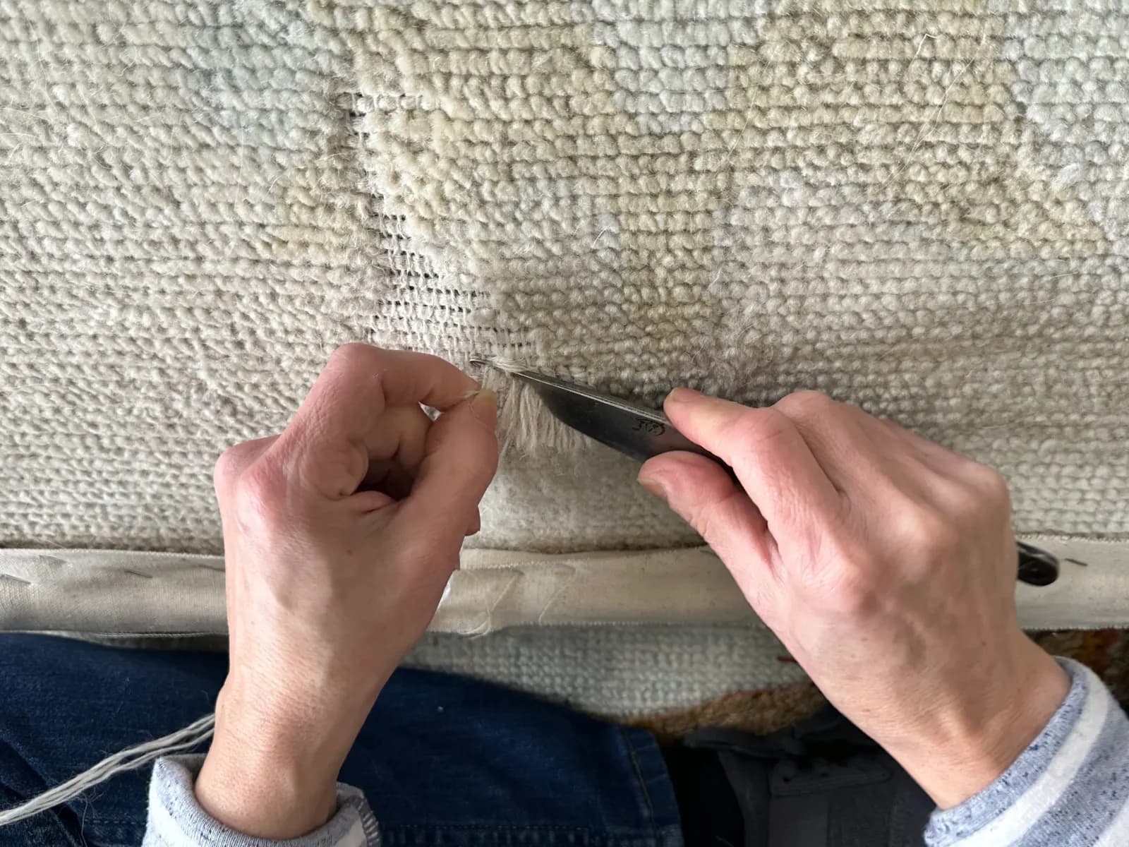 Knot-by-knot pile reweaving to rebuild a worn-flat area of an oriental rug — Ahmadi Rug, Skokie IL