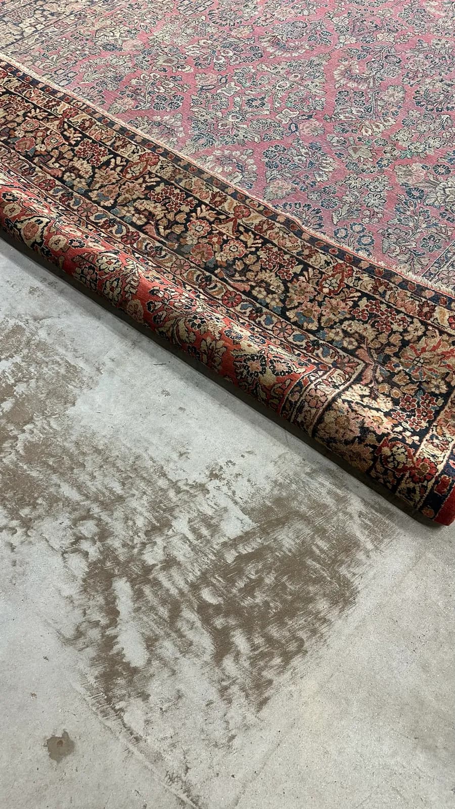 Dry soil and grit lifted from an oriental rug before washing — Ahmadi Rug workshop, Skokie IL